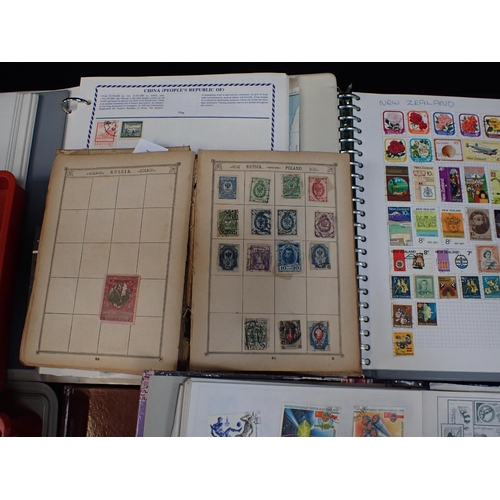 573 - A COLLECTION OF POSTAGE STAMPS, SOME IN ALBUMS many loose unsorted, Victorian GB, and later in an ol... 