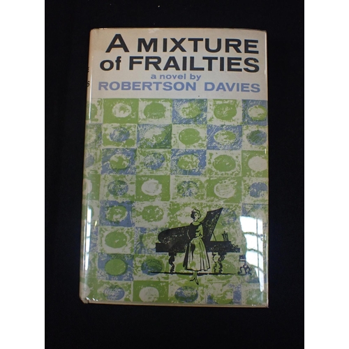 610 - ROBERTSON DAVIES: 'A MIXTURE OF FRAILTIES' Macmillan 1958, with unclipped jacket (some damage)