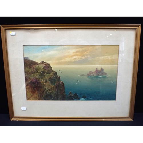 649 - MANNER OF F.T. WIDGERY: SEASCAPE with cliffs and rocks, indistinctly signed 48 x 64cm framed (spotte... 