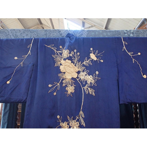 68 - A BLUE SILK KIMONO WITH GOLD COLOURED EMBROIDERY