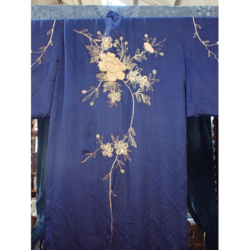 68 - A BLUE SILK KIMONO WITH GOLD COLOURED EMBROIDERY