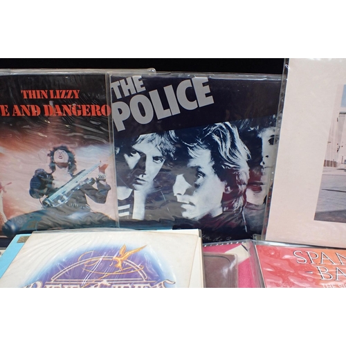 74 - A GOOD COLLECTION OF VINYL LPs IN THEIR PROTECTIVE SLEEVES A broad range of artists to include: Pink... 