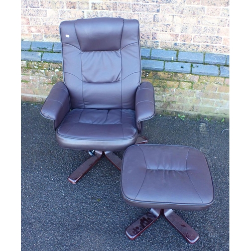 769 - A MODERN SWIVEL ARMCHAIR AND FOOTSTOOL in brown leatherette