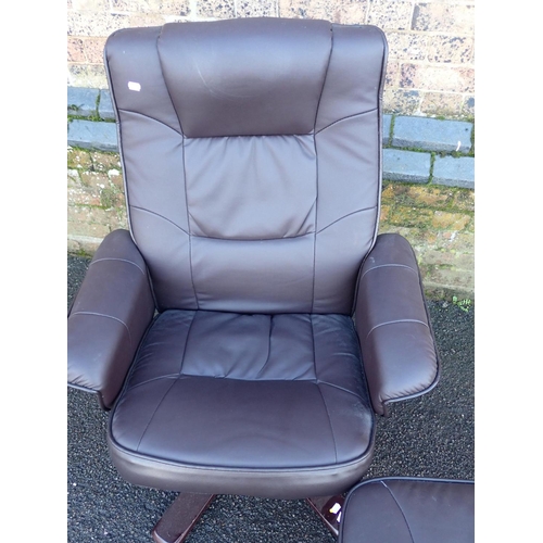 769 - A MODERN SWIVEL ARMCHAIR AND FOOTSTOOL in brown leatherette