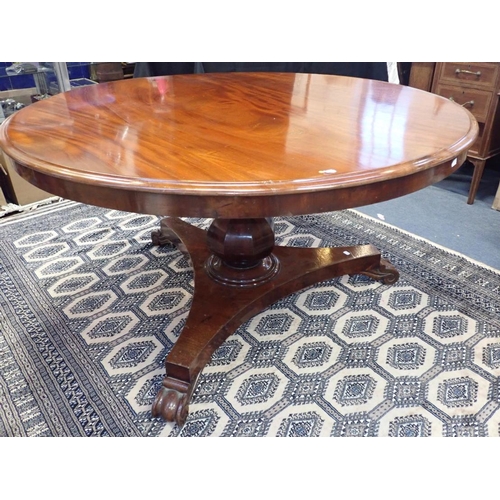 772 - A 19TH CENTURY MAHOGANY BREAKFAST TABLE with platform base, carved scrolling feet and octagonal balu... 