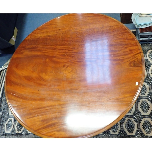 772 - A 19TH CENTURY MAHOGANY BREAKFAST TABLE with platform base, carved scrolling feet and octagonal balu... 