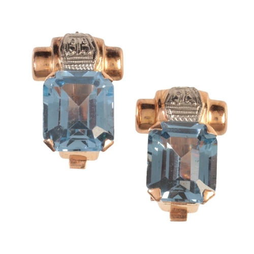 181 - A PAIR OF SYNTHETIC SPINEL CLIP EARRINGS

in 18ct white and rose gold, each set with a step cut blue... 