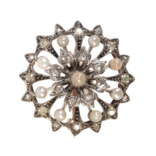 192 - AN ANTIQUE VICTORIAN DIAMOND AND PEARL BROOCH

in silver on 15ct gold, designed as concentric rows o... 