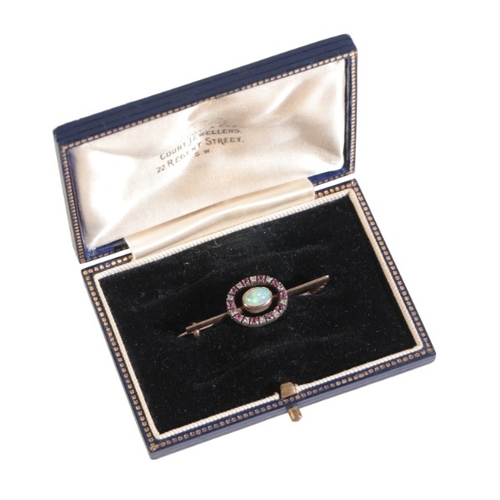 194 - AN ANTIQUE VICTORIAN OPAL, RUBY AND DIAMOND BROOCH

in silver on 9ct gold, set centrally with an opa... 