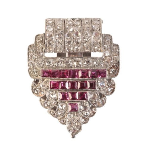 203 - A VINTAGE SYNTHETIC RUBY AND DIAMOND CLIP BROOCH

in 14ct white gold, c.1940s, set with calibré cut ... 