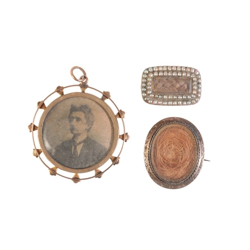 206 - A COLLECTION OF MOURNING BROOCHES

in 9ct gold, including a mourning brooch with woven hairwork unde... 