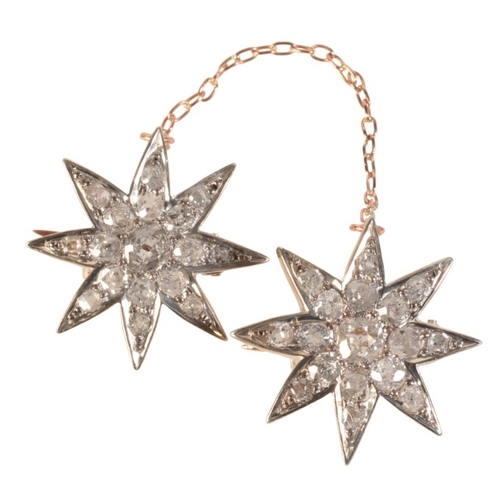 214 - A PAIR OF ANTIQUE VICTORIAN STAR BROOCHES

in silver on platinum and rose gold, both stars set throu... 