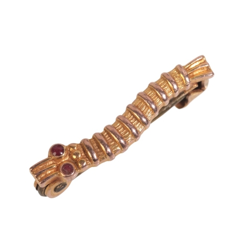 218 - A WWII CATERPILLAR CLUB BROOCH in 9ct gold, ruby cabochon set eyes, engraved to the reverse 'W/O S.G... 
