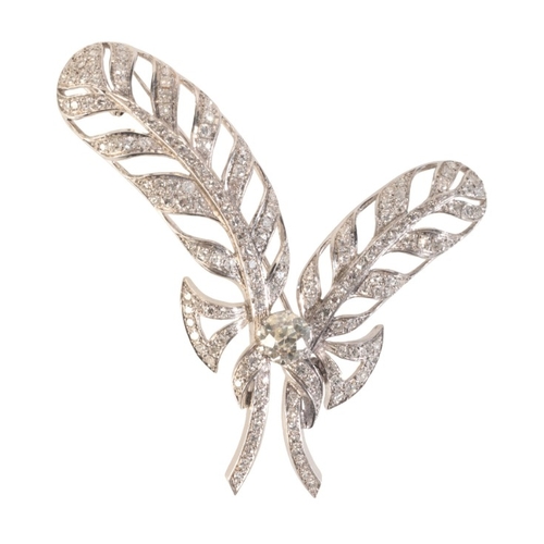 219 - A VINTAGE DIAMOND FEATHER BROOCH

in 18ct white gold and platinum, designed as two feathers, set to ... 