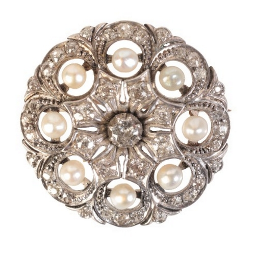 224 - AN ANTIQUE PEARL AND DIAMOND BROOCH

in silver on 9ct gold, set to the centre with an old mine cut d... 