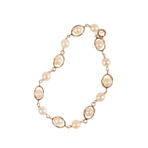 228 - A STYLISED PEARL BRACELET

in 14ct yellow gold, comprising a series of cage links with inserted loos... 