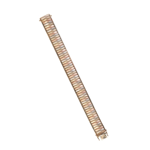231 - A THREE TONE GOLD BRACELET

in 9ct yellow, white and rose gold, comprising a series of rectangular t... 