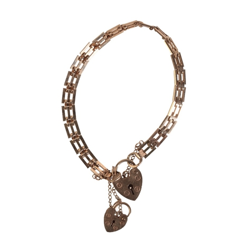 235 - AN VINTAGE GATE LINK BRACELET

in 9ct gold, comprising a series of stylised squared links, with two ... 