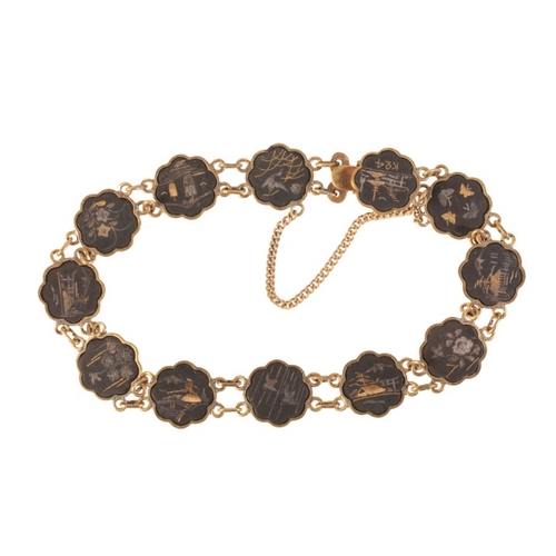 237 - AN ANTIQUE JAPANESE SHAKUDO BRACELET

in gold, silver and copper, comprising a series of stylised li... 