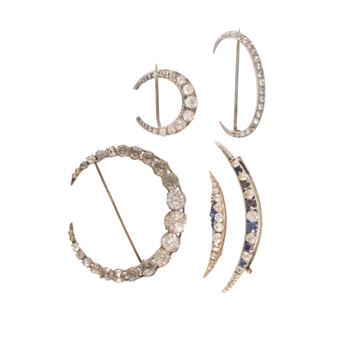 212 - A COLLECTION OF PASTE CRESCENT MOON BROOCHES

all of varying sizes, set throughout with paste stones... 