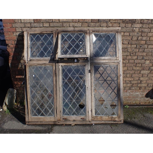 1 - A LARGE OAK-FRAMED CASEMENT WINDOW with leaded lights, and iron fittings 171cm high, 173.5cm wide (w... 