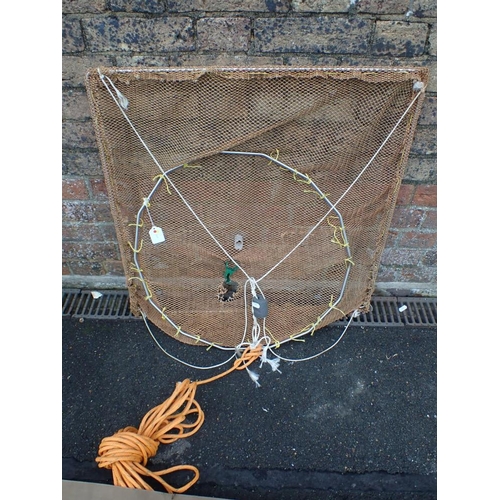 213 - A VINTAGE ARMY KIT COVER c.1950's, together with a square fishing net, 70 x 70cm (2)