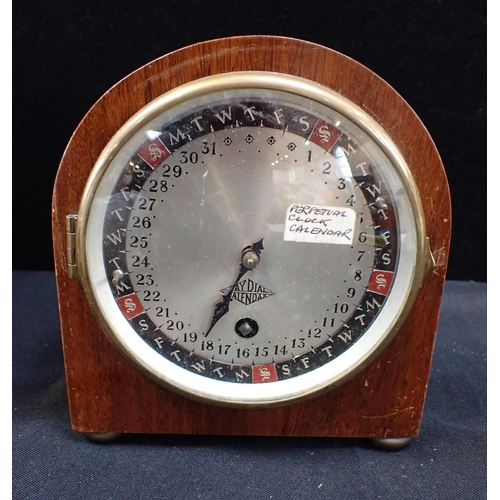 299 - A SMITHS PERPETUAL CLOCK CALENDAR and other clocks to include a barometer