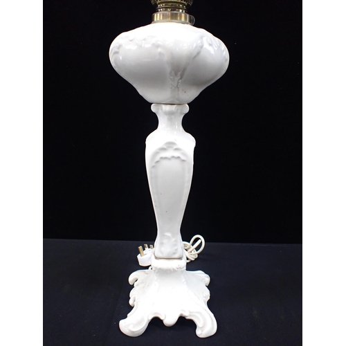 307 - A WHITE POTTERY OIL LAMP CONVERTED TO ELECTRICITY Art Nouveau style, 88 cms high