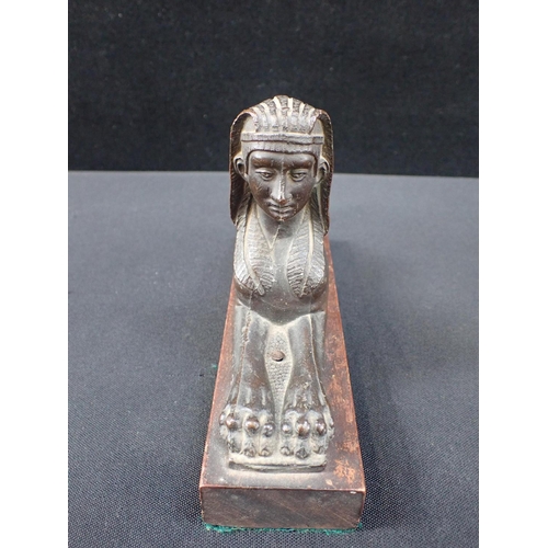 331 - A 19th CENTURY GRAND TOUR STYLE BRONZE SPHINX on wooden base 19.5cm long