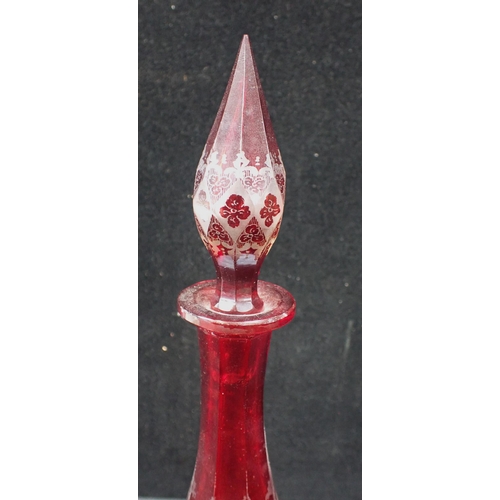 354 - A PAIR OF BOHEMIAN RED GLASS DECANTERS with etched decoration 41cm high