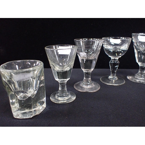 356 - A COLLECTION OF 19TH CENTURY TOASTING GLASSES or firing glasses, moulded, and an ice cream glass wit... 