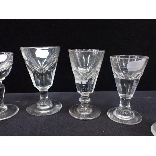 356 - A COLLECTION OF 19TH CENTURY TOASTING GLASSES or firing glasses, moulded, and an ice cream glass wit... 