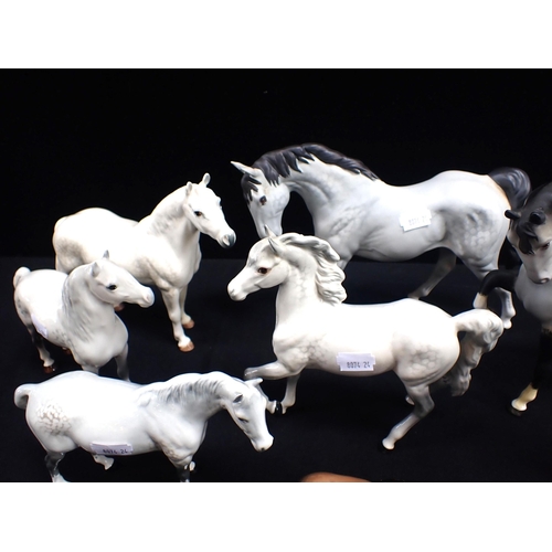 385 - A COLLECTION OF BESWICK PONIES Welsh, Connemara etc