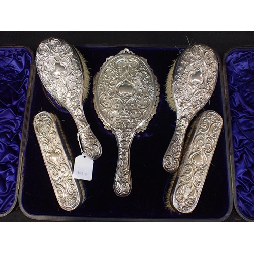 459 - A SILVER DRESSING TABLE SET in a velvet lined case, Samuel Jacob, London 1893 (some damage to silver... 