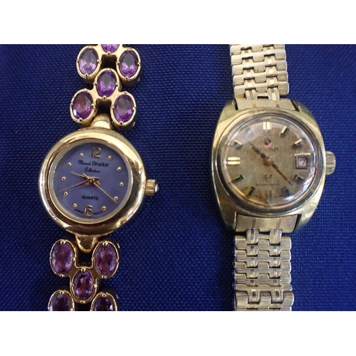 525 - THREE LADIES' WRISTWATCHES including a lady's Gucci dress watch in stainless steel with horse bit cl... 