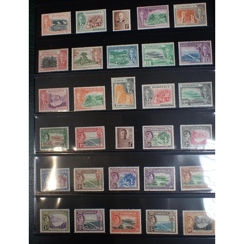 613 - AN ALBUM OF MINT UNMOUNTED STAMPS (GREEN) Bahamas, Newfoundland, Bermuda, Dominica, Ceylon, Nyasalan... 