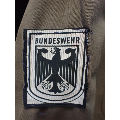 626 - TWO GERMAN MILITARY JACKETS with Bundeswehr badges, and a cap (3)