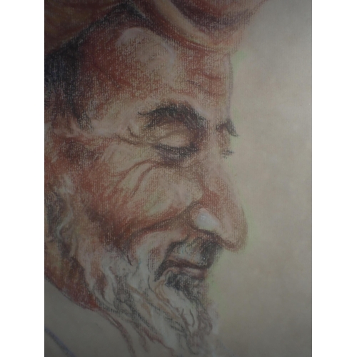 702 - A PASTEL DRAWING OF AN EASTERN MAN indistinctly signed