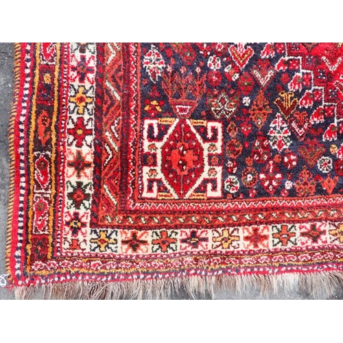 788 - A RED GROUND PERSIAN DESIGN RUG 170 x 254cm plus fringes