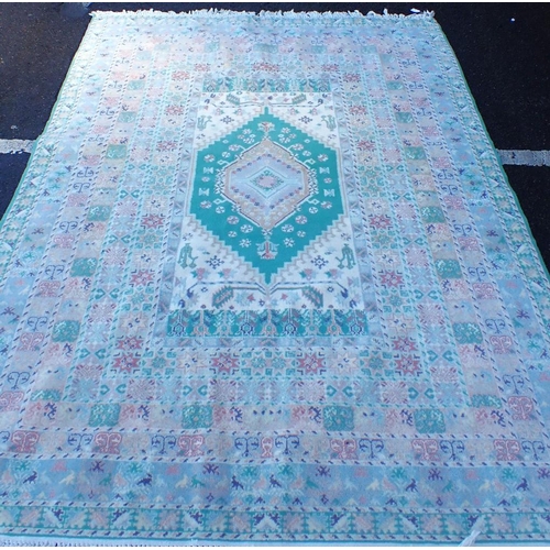 794 - A MOROCCAN RUG, IN PALE COLOURS 176 x 252cm plus fringes