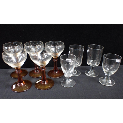 81 - FOUR VICTORIAN CLEAR GLASSES and five 'HSS 1857' monogrammed amber stemmed glasses