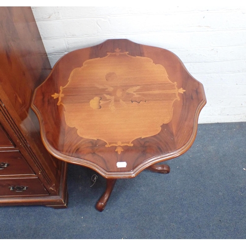 814 - A SMALL YEW VENEERED CHEST OF DRAWERS George III style, with four small drawers flanking a central d... 