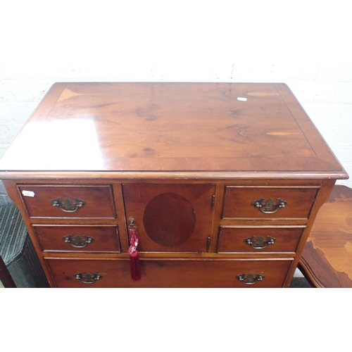 814 - A SMALL YEW VENEERED CHEST OF DRAWERS George III style, with four small drawers flanking a central d... 