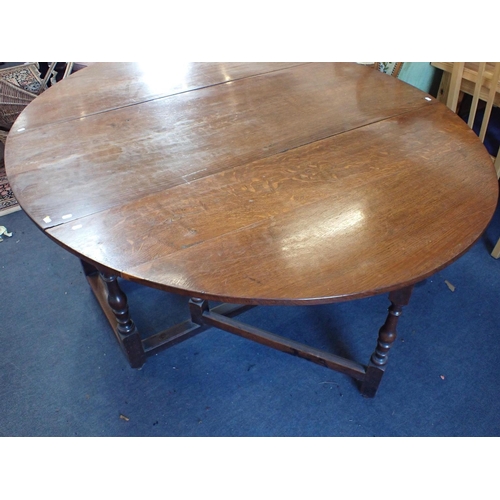 843 - A LARGE OAK GATELEG TABLE fitted a drawer, 18th century and later 153 x 180cm (open) (repairs, refin... 