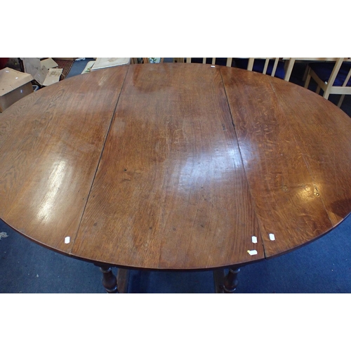 843 - A LARGE OAK GATELEG TABLE fitted a drawer, 18th century and later 153 x 180cm (open) (repairs, refin... 