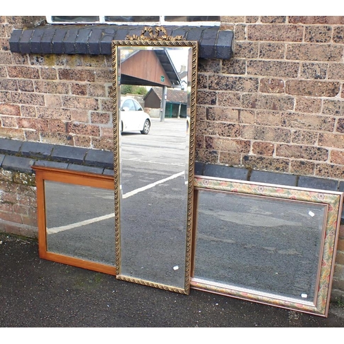 857 - A GILT FRAMED LONG WALL MIRROR with bevelled plate, 133 X 42cm, and two other mirrors (3)