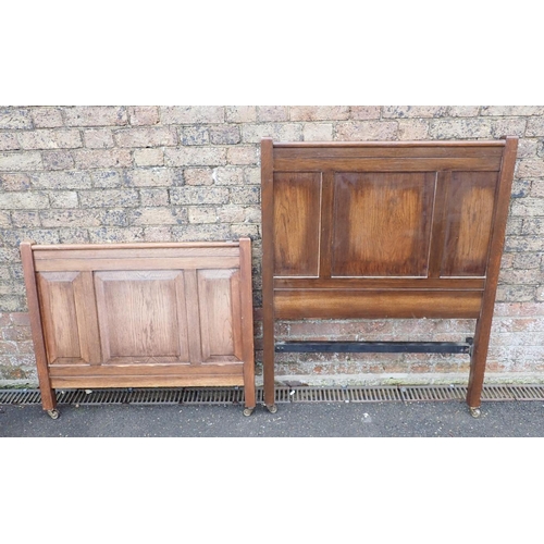 858 - A 1930s OAK SINGLE BED WITH PANELLED ENDS 92cm wide