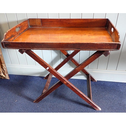 866 - A 19TH CENTURY MAHOGANY BUTLERS TRAY on folding stand (old repairs to tray sides)