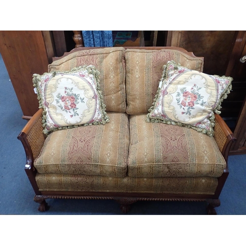 867 - A MAHOGANY FRAMED BERGERE SOFA two seat, with (intact) double-caned panels 137cm wide