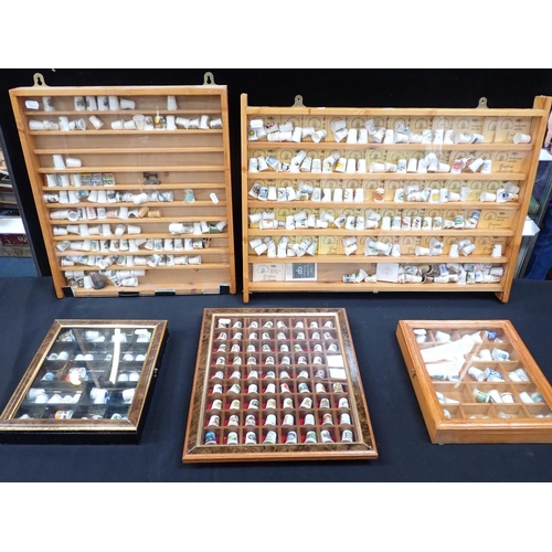 96 - A COLLECTION OF THIMBLES with display cases